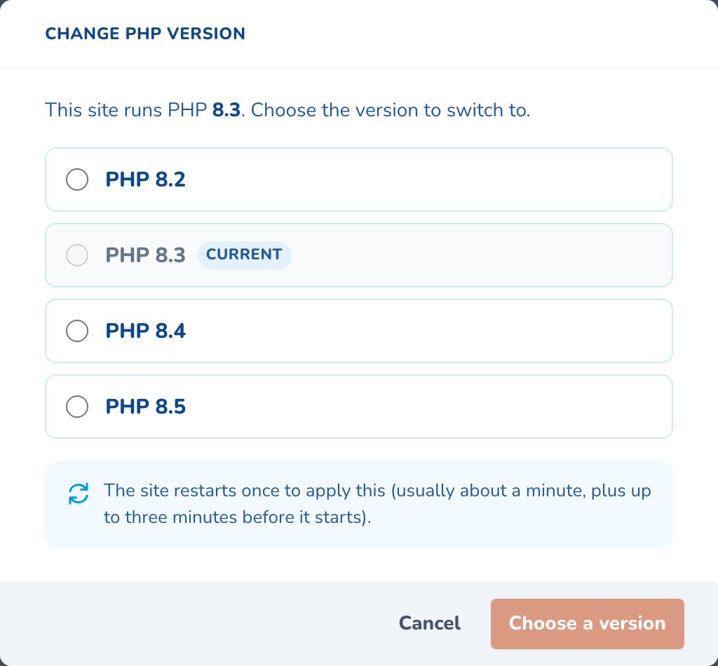 The Change PHP version dialog, listing PHP 8.2, 8.3, 8.4 and 8.5